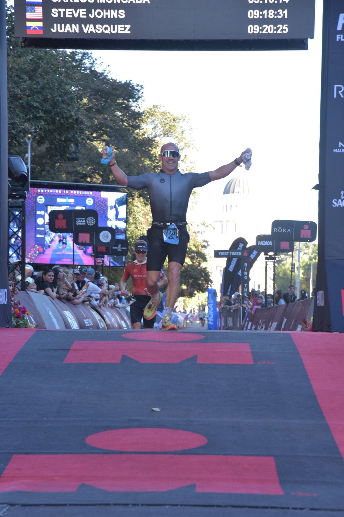 Andrew Cruz celebrating at the IRONMAN California finish line